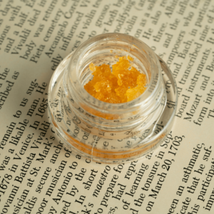 gold cannabis concentrate in glass jar