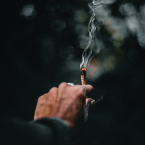 hand holding a burning joint