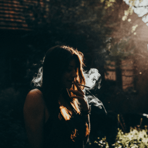 silhouette of a girl smoking a joint