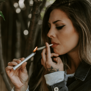 a girl smoking a joint