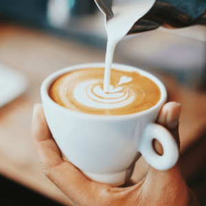 person creating latte art