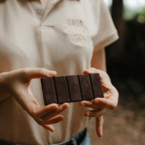 person eating brown chocolate bar