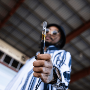 man holding dab pen