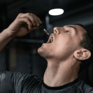 man consuming THC tincture