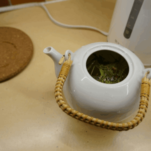 green leaves in a tea pot