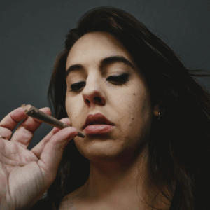 girl holding a pre-roll