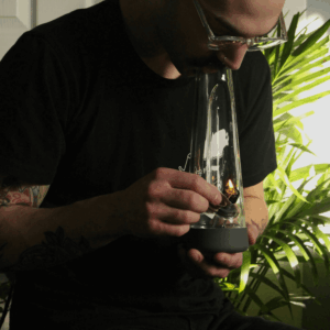 man lighting bong