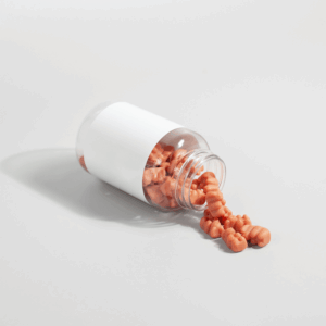 orange gummy bears spilling out of bottle