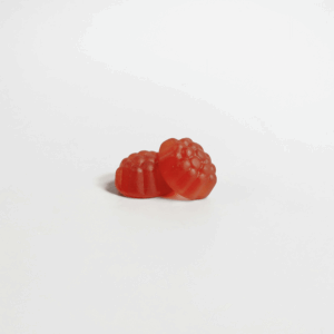 two red gummies against white background
