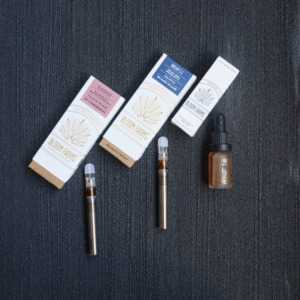 cannabis vape carts and tincture bottle