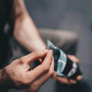 man holding blue gummy