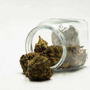 cannabis flower spilling out of jar