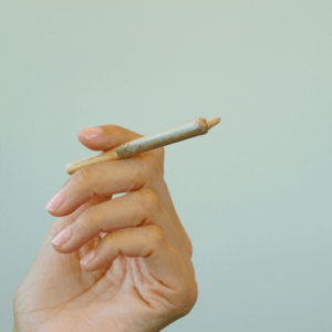 hand holding a rolled joint