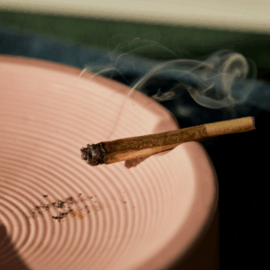 burning joint on pink dish