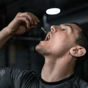 man consuming gold oil