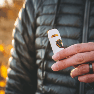 person holding white vape