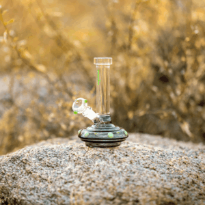 glass pipe sitting on a rock