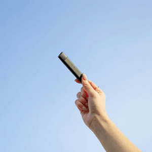 vape being held up to sky