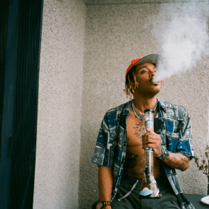 man hitting a bong