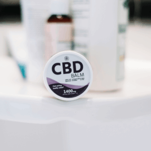 purple and white CBD balm packaging