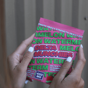 person holding delta munchies packaging