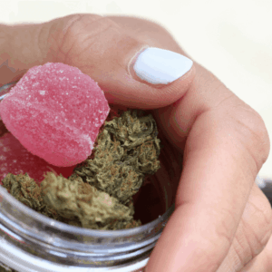 person holding nug jar with gummies