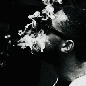 black and white image of man smoking