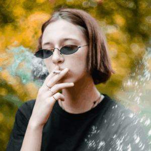 girl in sunglasses smoking
